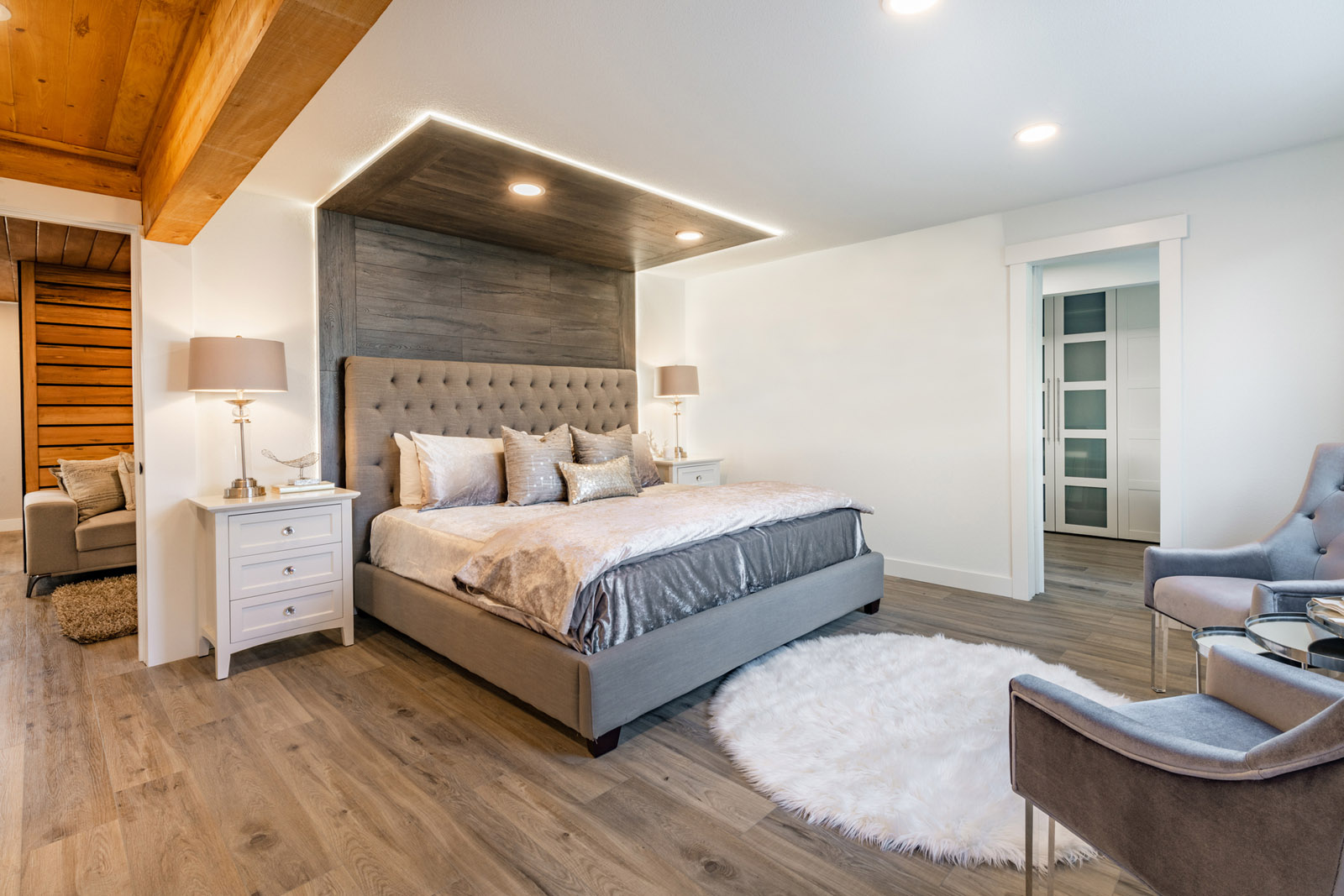 Finished basement on Long Island with media area, custom lighting, and built-in cabinetry
