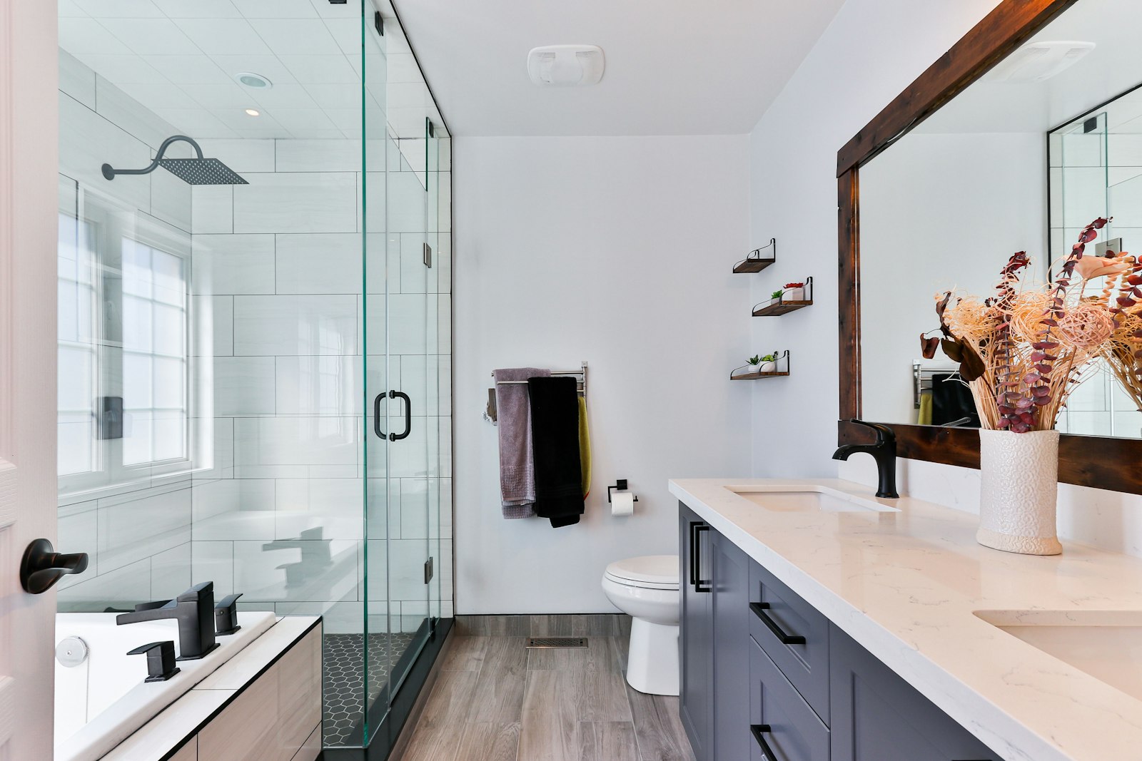 Luxury master bathroom with walk-in shower and freestanding tub in a Long Island home