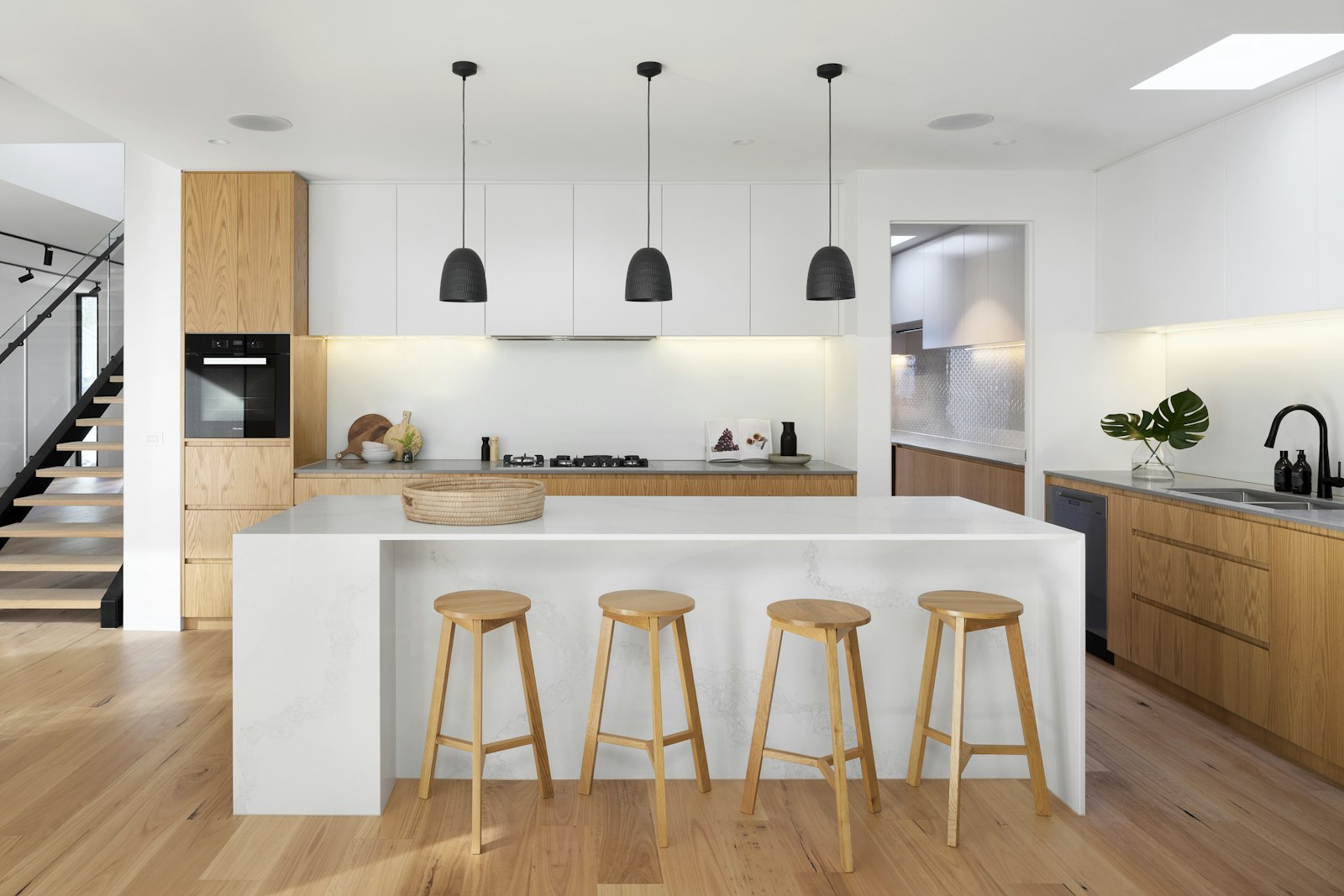 Luxury custom kitchen with large island and white cabinetry in a Long Island home