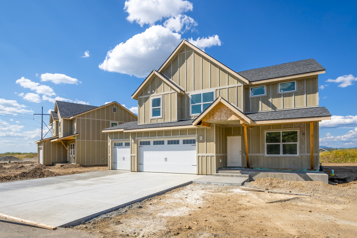 New custom home under construction on a wooded Long Island lot